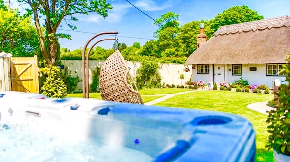 Cottage, hot tub and swing chair all for your relaxation 