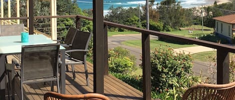 Relax on the deck and watch the waves roll in