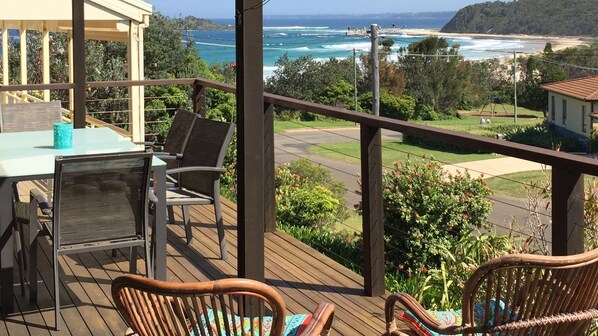 Relax on the deck and watch the waves roll in