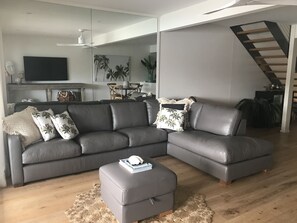 The lounge room flows out to the deck through bifold doors