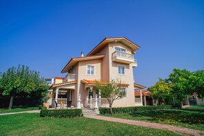 The exterior of the house and part of the gardens