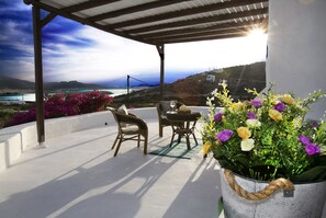 Stunning Patio Views of Sunrises and Sunsets glimmering over The Aegean Sea and 