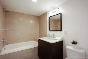 Second bedroom ensuite bathroom, a soothing deep bath tub and shower