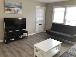 Living room. Door leads to covered porch 