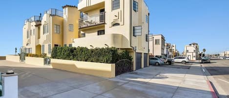 South side of the beach house is on a walking street, no cars.