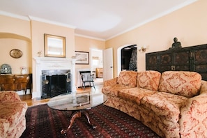Living room with 2 couches and working fireplace
