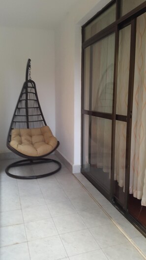 Balcony from living area, with sliding door and swing