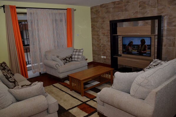Living room with balcony overlooking the rest of the property