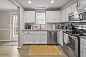 Fully-equipped kitchen with appliances & cooking essentials