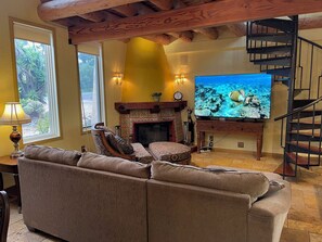 Living room with 75 inch smart TV.