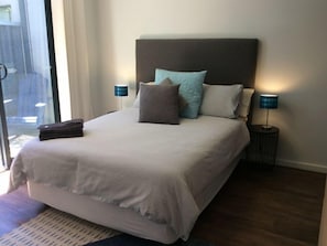 Two bedrooms with block out curtains and natural light filled spaces