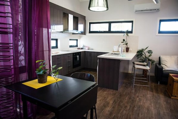 Fully equipped kitchen with full sized fridge