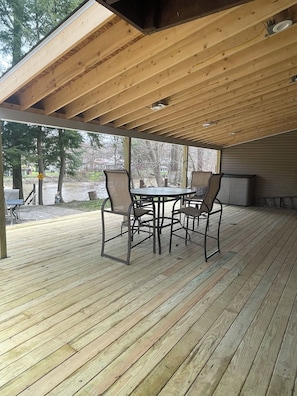 Beautiful covered deck to have coffee or drinks