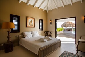 Master bedroom with direct entrance to pool and private bathroom.  