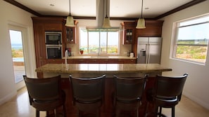 Kitchen with microwave, oven, coffee maker, Blender