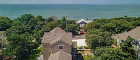 Drone view of home with bay in the distance