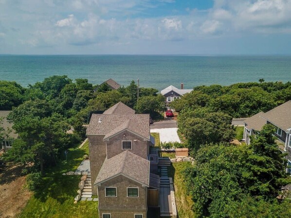 Drone view of home with bay in the distance