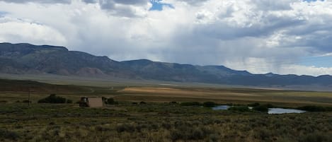 cabin with  pond and empty valley. short ride to forest/mountains