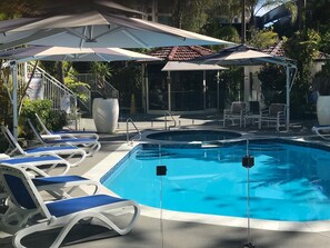 New Pool, sun lounges and umbrellas
