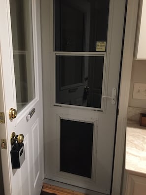 Pet friendly home with dog door leading out to large fenced in back yard.