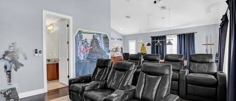 Relax on the 6 leather recliners and sofa seating and watch movies on the 120-inch projector screen with surround sound