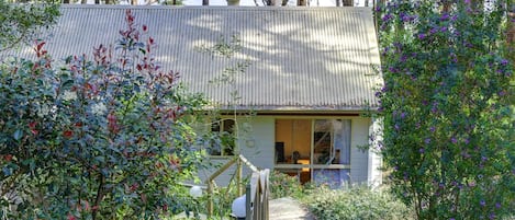 Cute cottage tucked in among the trees, sweeping lake views