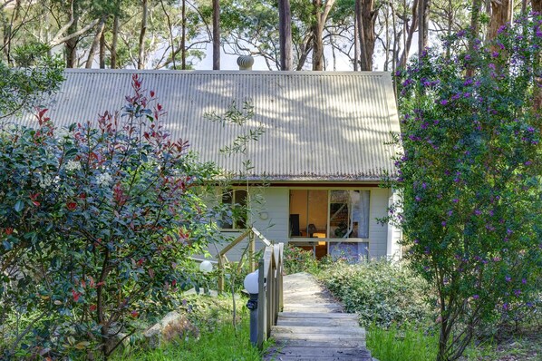 Cute cottage tucked in among the trees, sweeping lake views