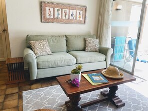 Comfortable Living Room. Open plan with views out to the pool and garden
