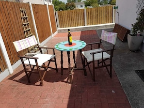 Spacious Patio with chairs and table. The hot tub can be positioned here too