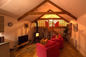 Use subdued lighting and the wood burner to create a cosy ambience