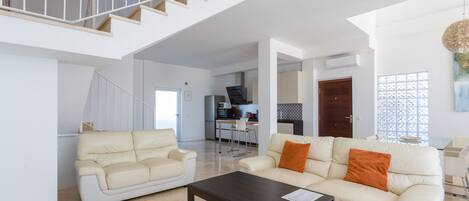 Spacious and bright living room with the kitchen on the back