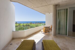 Main room's terrace with sunbeds and coffee area