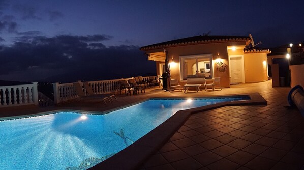 Enjoy quiet, ambient, cool nights sitting around the pool.