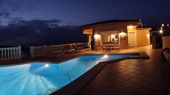 Enjoy quiet, ambient, cool nights sitting around the pool.