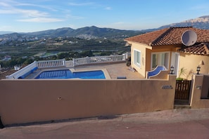 Casa Christina viewed from the mountains over the road.