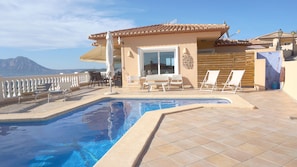 Deck chairs and sunbeds, outdoor shower and dining area to enjoy.