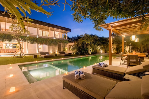 Private pool area with beautiful night lighting