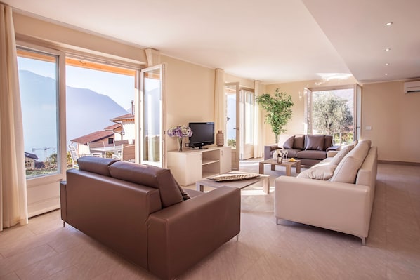 Relax in the open plan living room here at Ossuccio Grande "C" Home sleeps 12.