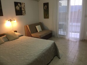 Bedroom with king-size bed and sofa-bed