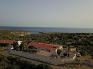 Villa air view with the mediterranean sea in the background