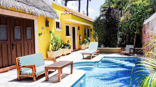 Suite opens to the pool/garden.