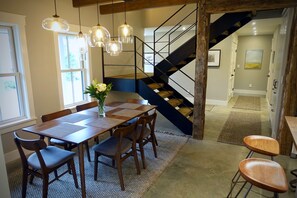 Spacious, light-filled dining area and contemporary stairs.