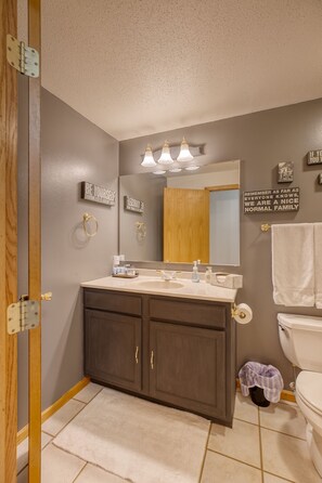 This bath has a tub and shower.