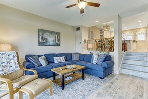 Living room looking into kitchen and dining area