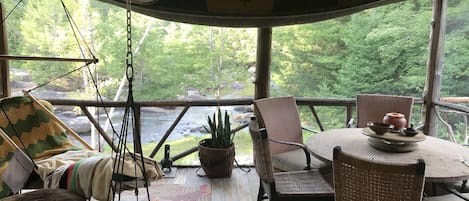 Screen In Porch overlooking River, stream side dining. 