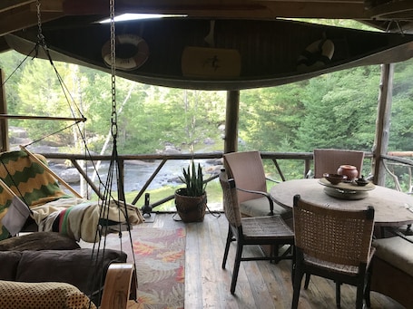 Screen In Porch overlooking River, stream side dining.