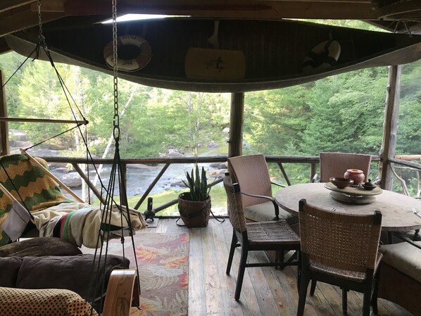 Screen In Porch overlooking River, stream side dining. 
