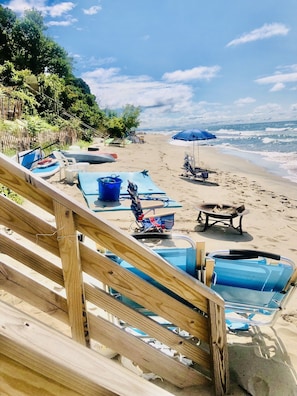Beach chairs, firepit, 2 kayaks, 2 paddle boards, big floating pad for your use.