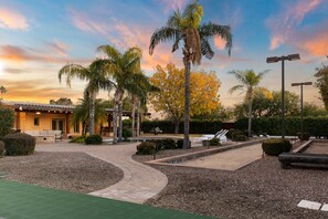 Outdoor Area w/ Pool & Bocce Ball Court in Background