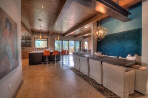 Enjoy a home cooked meal at the banquette or around the marble counter tops